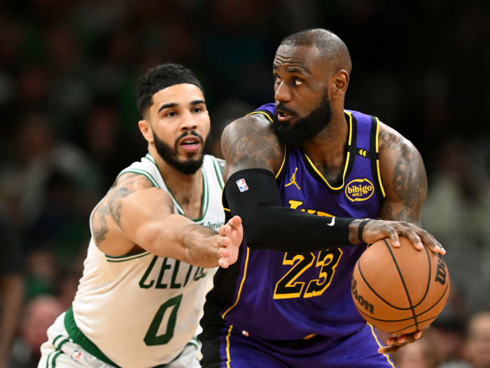 Mar 8, 2025; Boston, Massachusetts, USA; Los Angeles Lakers forward LeBron James (23) controls the ball against Boston Celtics forward Jayson Tatum (0) during the fourth quarter at the TD Garden. Mandatory Credit: Brian Fluharty-Imagn Images