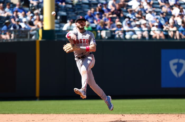 Boston Red Sox shortstop Trevor Story (10) throws out Kansas City Royals outfielder Kyle Isbel (28) at Kauffman Stadium.