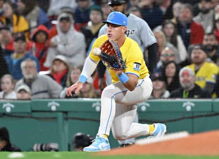 Boston Red Sox first baseman Romy Gonzalez (23) makes a catch for an out against the Chicago White Sox during the sixth inning at Fenway Park.