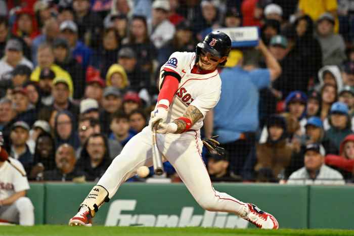Boston Red Sox outfielder Jarren Duran (16) hits a double against the New York Mets during the fourth inning at Fenway Park.