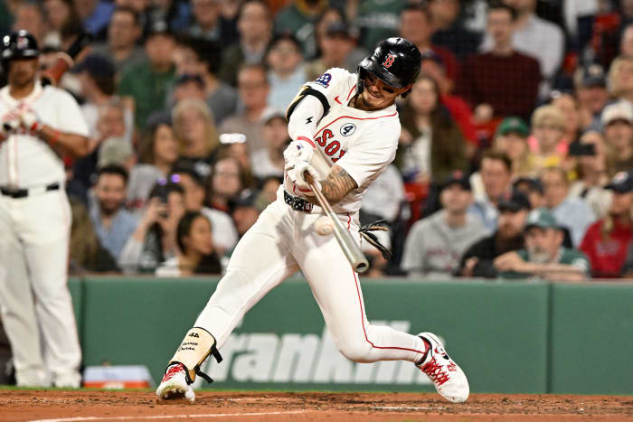 Boston Red Sox outfielder Jarren Duran (16) hits a double against the Los Angeles Angels during the fifth inning at Fenway Park.