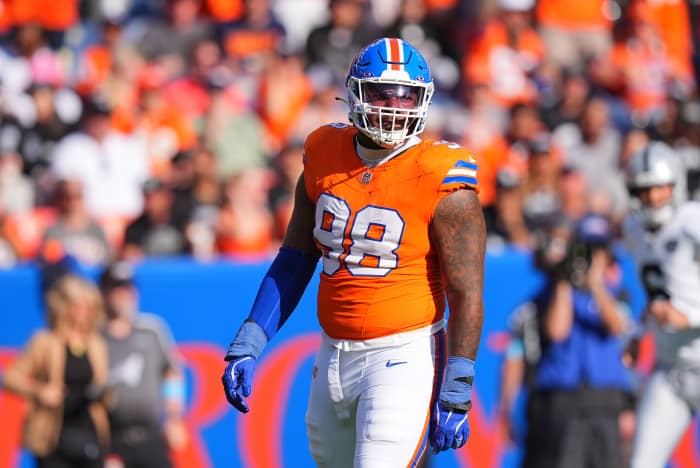 Denver Broncos defensive end John Franklin-Myers (98) reacts to a defensive stop in the second half against the Las Vegas Raiders at Empower Field at Mile High.