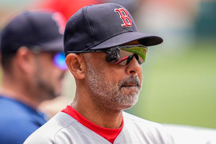 Boston Red Sox manager Alex Cora (13) in the dugout before the game against the Atlanta Braves at Truist Park.