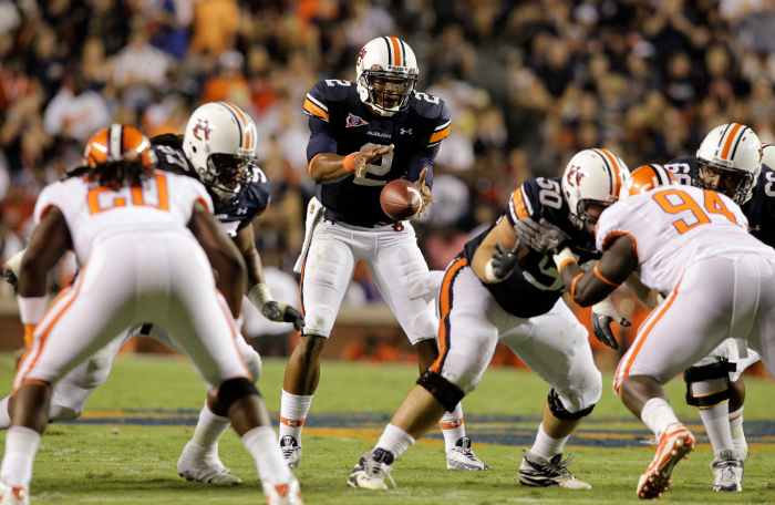 Auburn Tigers quarterback Cam Newton (2) takes a snap during the second half against the Clemson Tigers at Jordan Hare Stadium in Auburn. Auburn beat Clemson 27-24 in overtime.