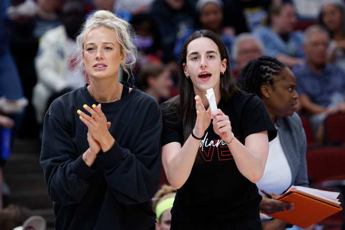 Indiana Fever guard Sophie Cunningham (8) and guard Caitlin Clark (22).