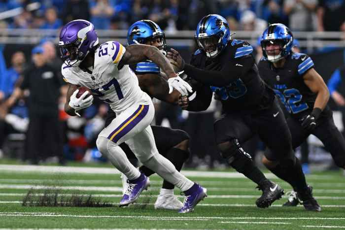 Minnesota Vikings running back Cam Akers (27) runs the ball against the Detroit Lions. Mandatory Credit: Lon Horwedel-Imagn Images