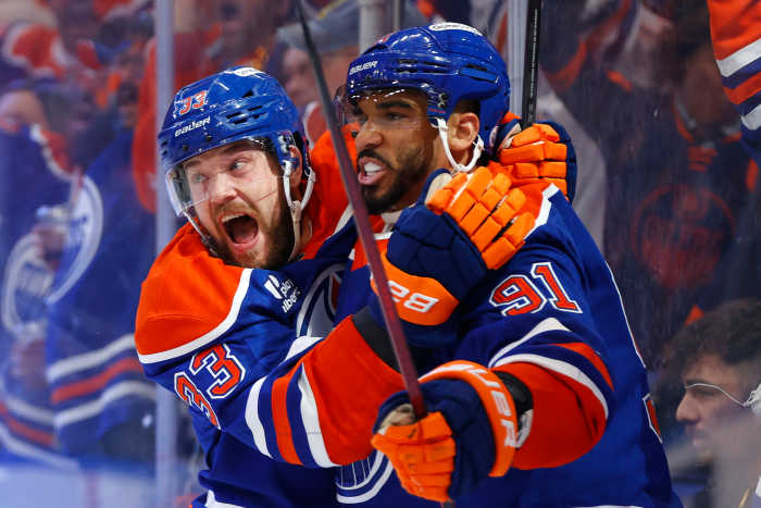 Edmonton Oilers left wing Evander Kane (91) reacts with left wing Viktor Arvidsson (33) after scoring a goal against the Florida Panthers.