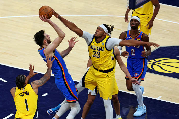 Pacers center Myles Turner (33) blocks the shot of Thunder forward Chet Holmgren (7).