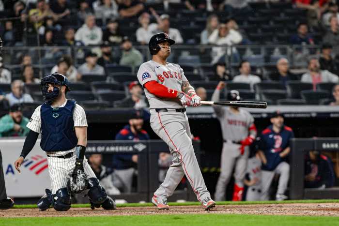 Jun 8, 2025; Bronx, New York, USA; Boston Red Sox designated hitter Rafael Devers (11) reacts after hitting a solo home run against the New York Yankees during the ninth inning at Yankee Stadium.