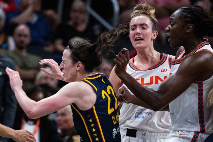 Connecticut Sun guard Marina Mabrey (3) fouls Indiana Fever guard Caitlin Clark (22) in the second half at Gainbridge Fieldhouse.