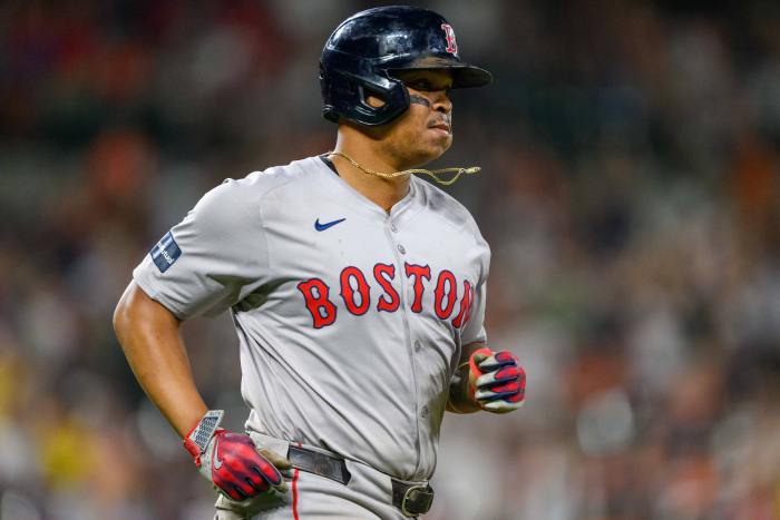 Boston Red Sox third baseman Rafael Devers (11) runs to first base after hitting a home run during the eighth inning against the Baltimore Orioles at Oriole Park at Camden Yards.