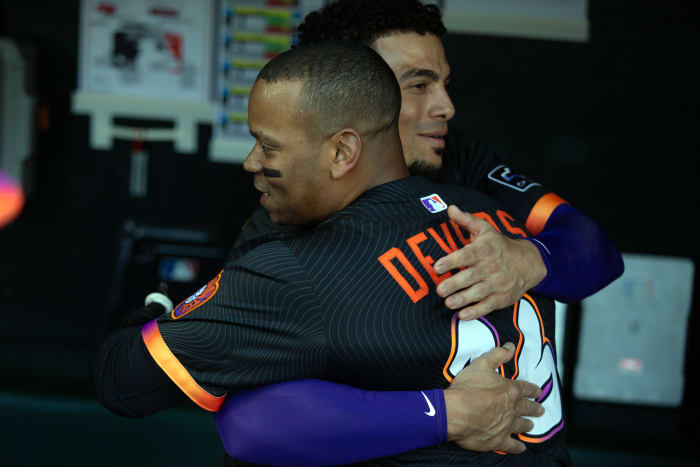 San Francisco Giants designated hitter Rafael Devers (16) greets new teammate Willy Adames before taking on the Cleveland Guardians at Oracle Park.