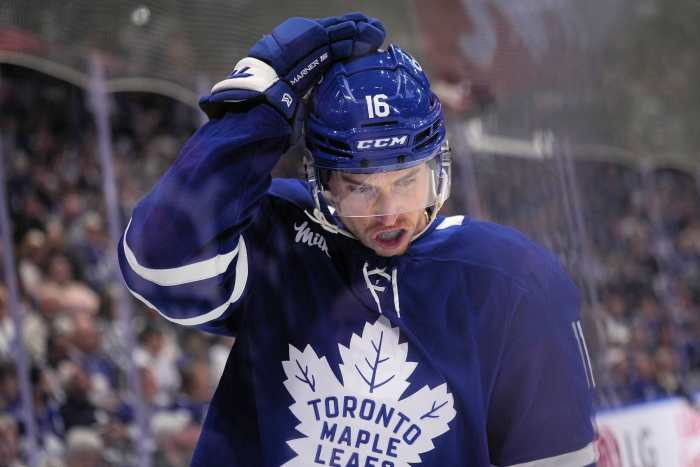 Toronto Maple Leafs forward Mitch Marner (16) adjusts his helmet after a play against the Florida Panthers during the first period of game seven of the second round of the 2025 Stanley Cup Playoffs at...