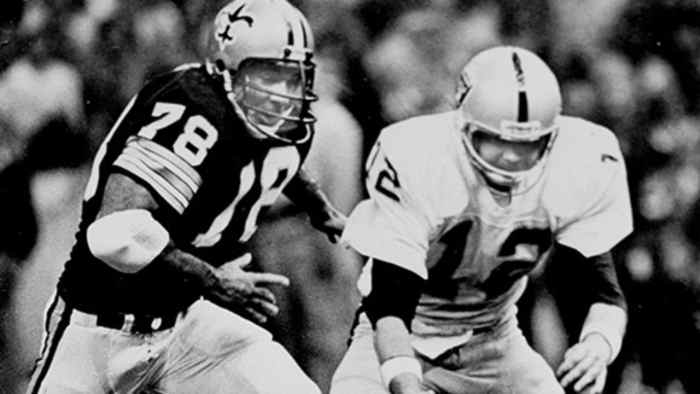 New Orleans Saints defensive end Elois Grooms (78) closes in on Oakland Raiders quarterback Ken Stabler (12). Credit: neworleanssaints.com