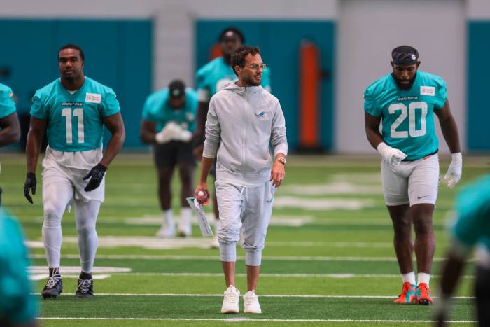 Miami Dolphins head coach Mike McDaniel watches practice during mandatory minicamp at Hard Rock Stadium.