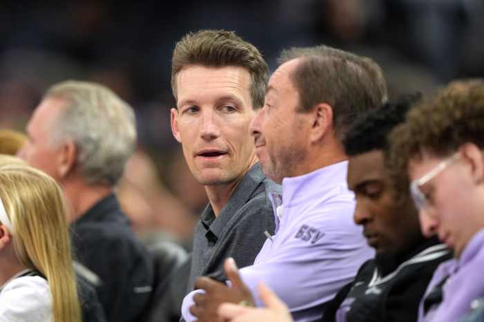 Jun 19, 2025; San Francisco, California, USA; Golden State Warriors general manager Mike Dunleavy (center left) talks with Golden State Valkyries co-owner Joe Lacob (center right) during the fourth quarter against the Indiana Fever at Chase Center. Mandatory Credit: Darren Yamashita-Imagn Images