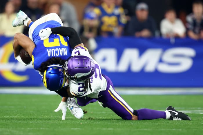 Los Angeles Rams wide receiver Puka Nacua (17) makes a catch against Minnesota Vikings cornerback Stephon Gilmore (2) during the second half in an NFC wild card game at State Farm Stadium.