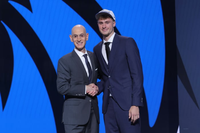 Dallas Mavericks forward Cooper Flagg poses with NBA commissioner Adam Silver.