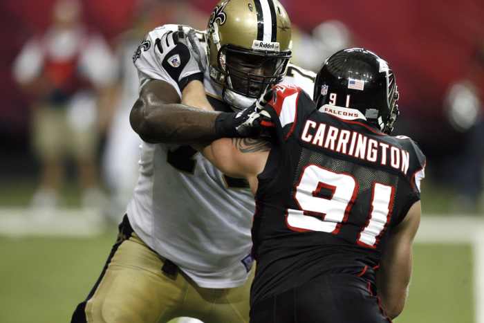 Nov 26, 2006; Atlanta Falcons defensive end Paul Carrington (91) is blocked by by New Orleans Saints tackle Jammal Brown (70). Mandatory Credit: Photo by Dale Zanine Imagn Images Copyright (c) 2006 Dale Zanine