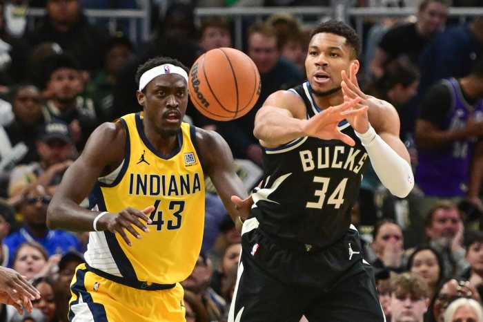Milwaukee Bucks forward Giannis Antetokounmpo passes the ball as Indiana Pacers forward Pascal Siakam defends during their playoff game at Fiserv Forum on April 27, 2025.
