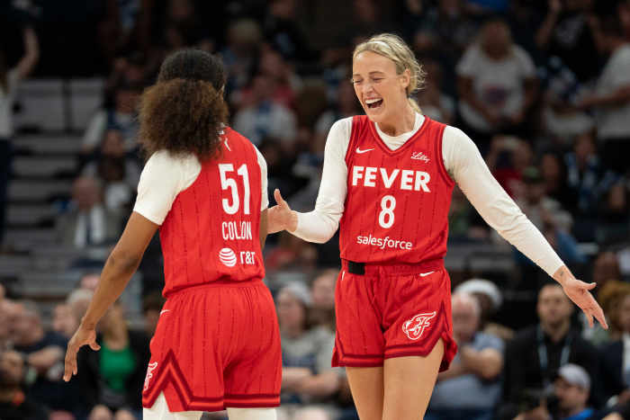Indiana Fever guard Sophie Cunningham (8) celebrates with teammate Sydney Colson (51) after defeating the Minnesota Lynx during the Commissioner's Cup final at Target Center.