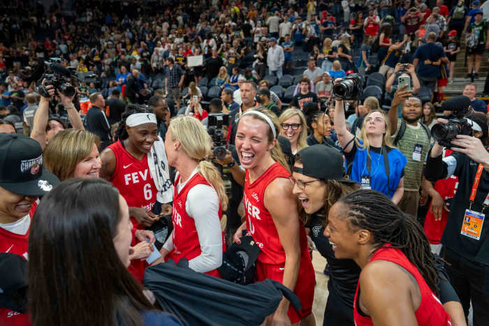 The Indiana Fever celebrate after defeating the Minnesota Lynx in the Commissioner's Cup Championship.