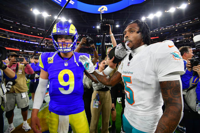 Los Angeles Rams quarterback Matthew Stafford meets with Miami Dolphins cornerback Jalen Ramsey. 