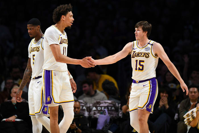 Los Angeles, California, USA; Los Angeles Lakers guard Austin Reaves (15) fives Los Angeles Lakers center Jaxson Hayes (11)