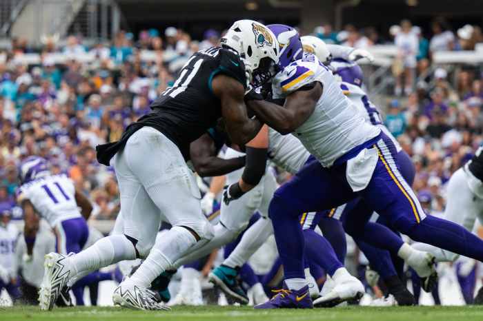 Nov 10, 2024; Jacksonville, Florida, USA; Jacksonville Jaguars defensive end Josh Hines-Allen (41) battles against Minnesota Vikings tackle Cam Robinson (74) in the second quarter at EverBank Stadium.