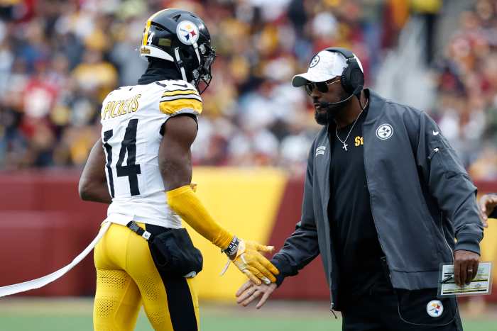 Nov 10, 2024; Landover, Maryland, USA; Pittsburgh Steelers head coach Mike Tomlin (R) congratulates Steelers wide receiver George Pickens (14) after a long catch against the Washington Commanders during the second half at Northwest Stadium.