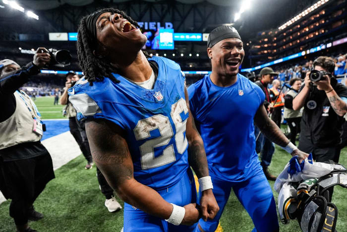 Jahmyr Gibbs and David Montgomery celebrate after a win vs. Green Bay.
