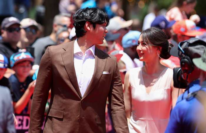Los Angeles Dodgers pitcher Shohei Ohtani walks the red carpet with wife Mamiko Tanaka.