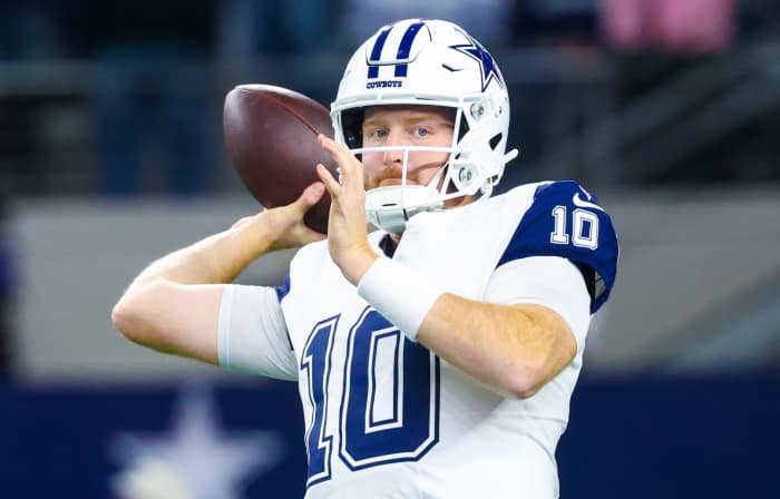 Dec 9, 2024; Arlington, Texas, USA; Dallas Cowboys quarterback Cooper Rush (10) warms up before the game against the Cincinnati Bengals at AT&T Stadium. Mandatory Credit: Kevin Jairaj-Imagn Images