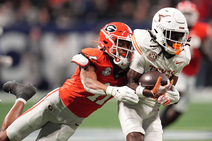 Texas Longhorns wide receiver Silas Bolden (11) makes a catch agaistn Georgia Bulldogs linebacker Jalon Walker (11) during the first half in the 2024 SEC Championship game.