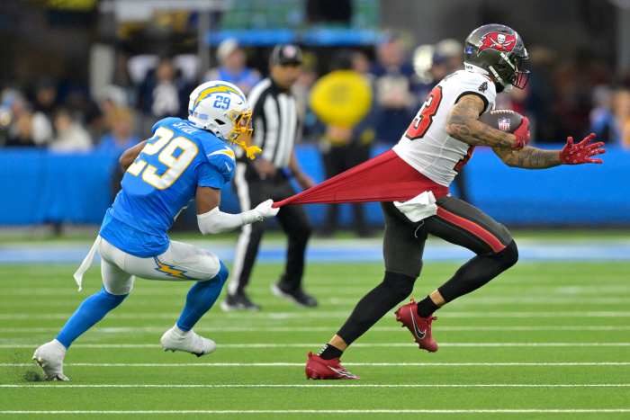 Mike Evans (13) is stopped by Tarheeb Still (29) after a complete pass.