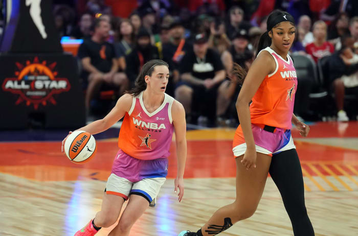WNBA guard Caitlin Clark (22) dribbles alongside Team WNBA forward Angel Reese (5) against USA Women's National Team during the WNBA All Star Game at Footprint Center.Joe Camporeale-Imagn Images
