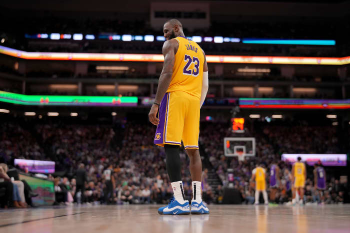 Los Angeles Lakers forward LeBron James (23) smiles at the team bench.