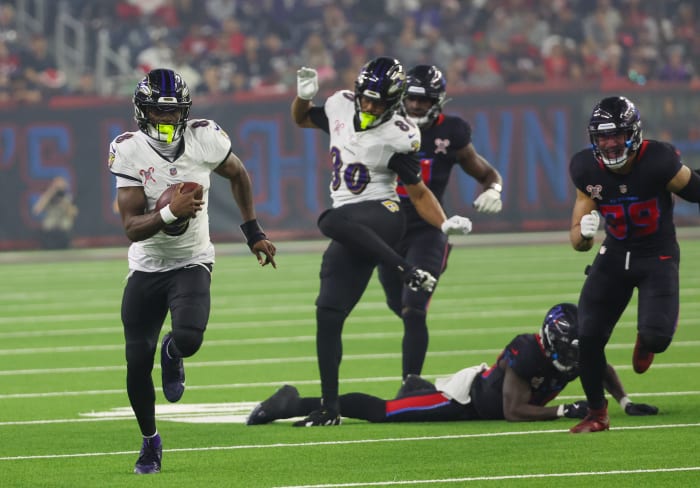 Dec 25, 2024; Houston, Texas, USA; Baltimore Ravens quarterback Lamar Jackson (8) rushes for a 48 yard touchdown against the Houston Texans in the third quarter at NRG Stadium. Mandatory Credit: Thomas Shea-Imagn Images