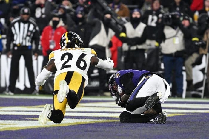 Jan 11, 2025; Baltimore, Maryland, USA; Baltimore Ravens wide receiver Rashod Bateman (7) scores a touchdown against Pittsburgh Steelers cornerback Donte Jackson (26) in the first quarter in an AFC wild card game at M&T Bank Stadium. Mandatory Credit: Tommy Gilligan-Imagn Images