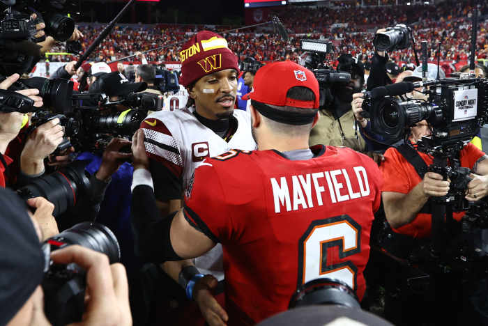 Washington Commanders quarterback Jayden Daniels (5) greets Tampa Bay Buccaneers quarterback Baker Mayfield (6).