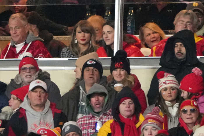 Jan 18, 2025; Kansas City, Missouri, USA; Recording artist Taylor Swift (upper middle) sits with Indiana Fever guard Caitlin Clark (upper right) during the fourth quarter of a 2025 AFC divisional round game between the Kansas City Chiefs and the Houston Texans at GEHA Field at Arrowhead Stadium. Mandatory Credit: Denny Medley-Imagn Images