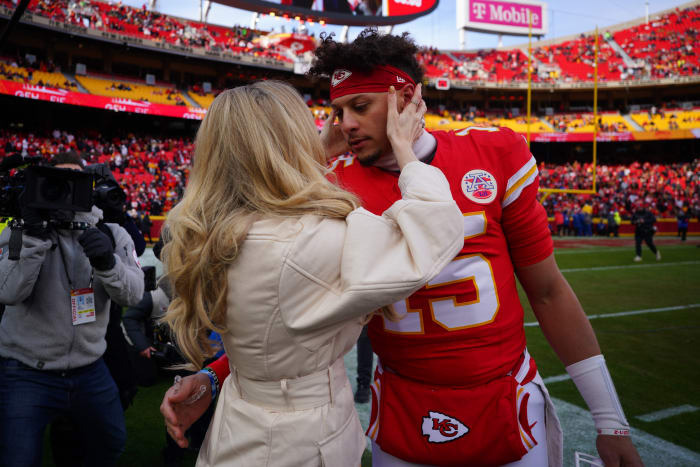 Kansas City Chiefs quarterback Patrick Mahomes kisses his wife Brittany Mahomes.