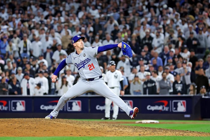 Los Angeles Dodgers pitcher Walker Buehler (21) pitches during the ninth inning against the New York Yankees.