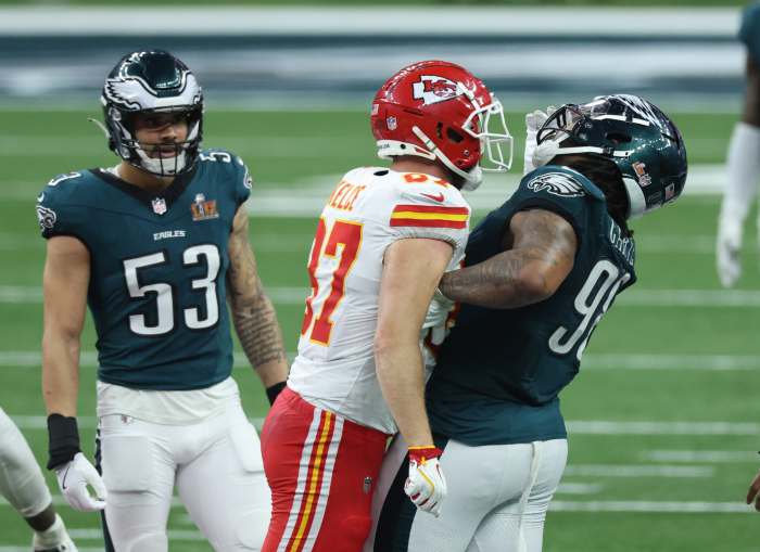 Kansas City Chiefs tight end Travis Kelce (87) bumps into Philadelphia Eagles defensive tackle Jalen Carter (98) in the fourth quarter in Super Bowl LIX.