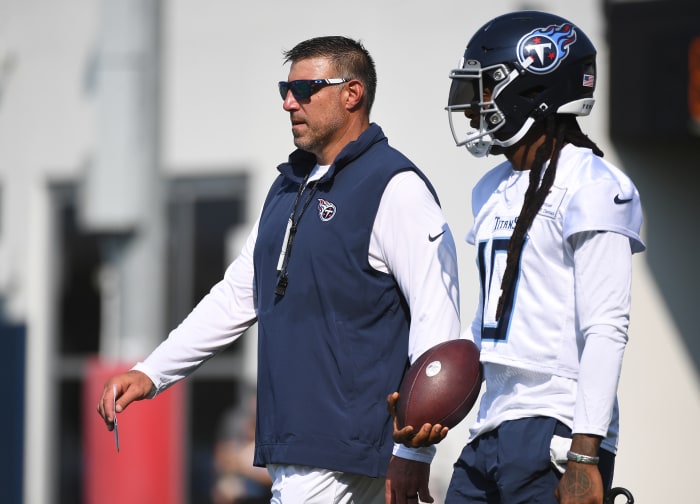 Tennessee Titans wide receiver DeAndre Hopkins (10) talks with head coach Mike Vrabel.