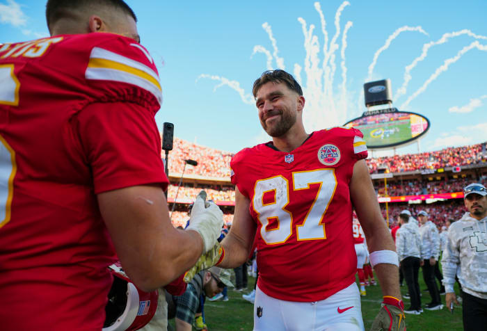 Kansas City Chiefs TE Travis Kelce celebrates with defensive end George Karlaftis after defeating the Denver Broncos.