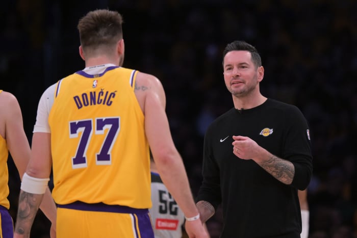Los Angeles Lakers guard Luka Doncic and head coach JJ Redick.