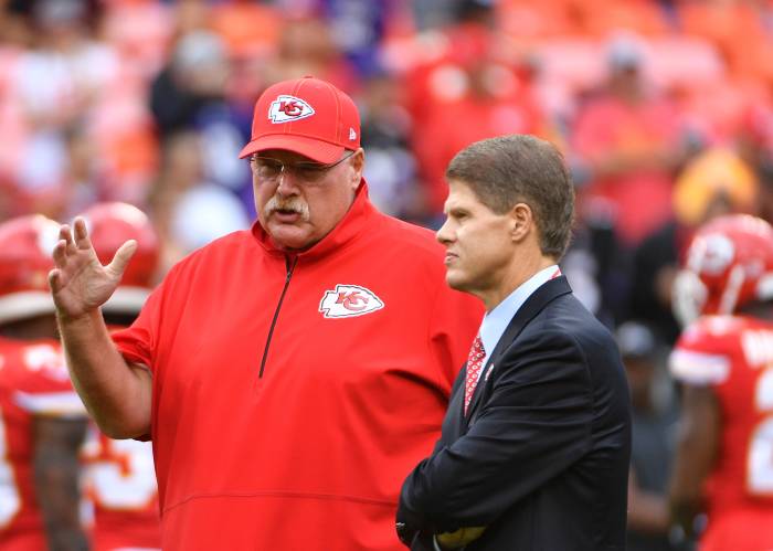 Kansas City Chiefs head coach Andy Reid talks with chairman Clark Hunt.