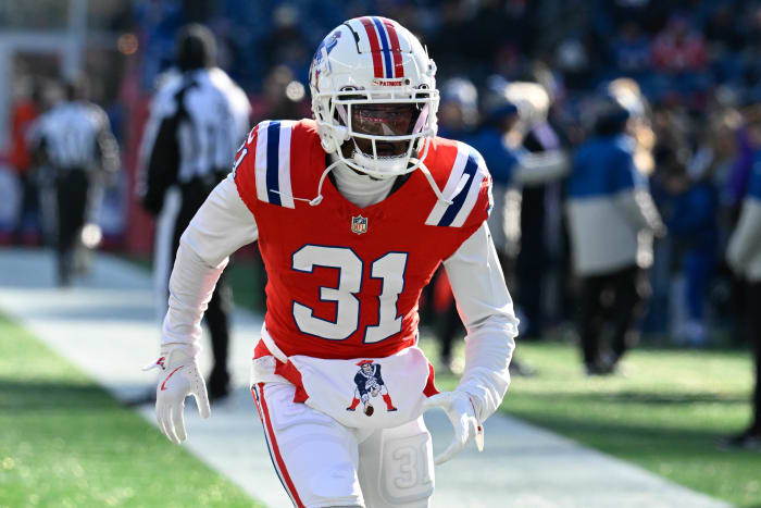 New England Patriots cornerback Jonathan Jones (31) warms up before a game against the Indianapolis Colts at Gillette Stadium.