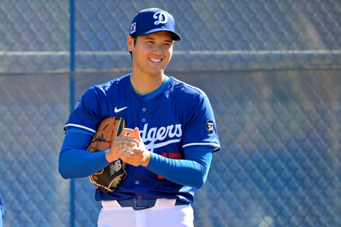 Los Angeles Dodgers designated hitter Shohei Ohtani (17) throws a bullpen session during spring training workouts at Camelback Ranch.